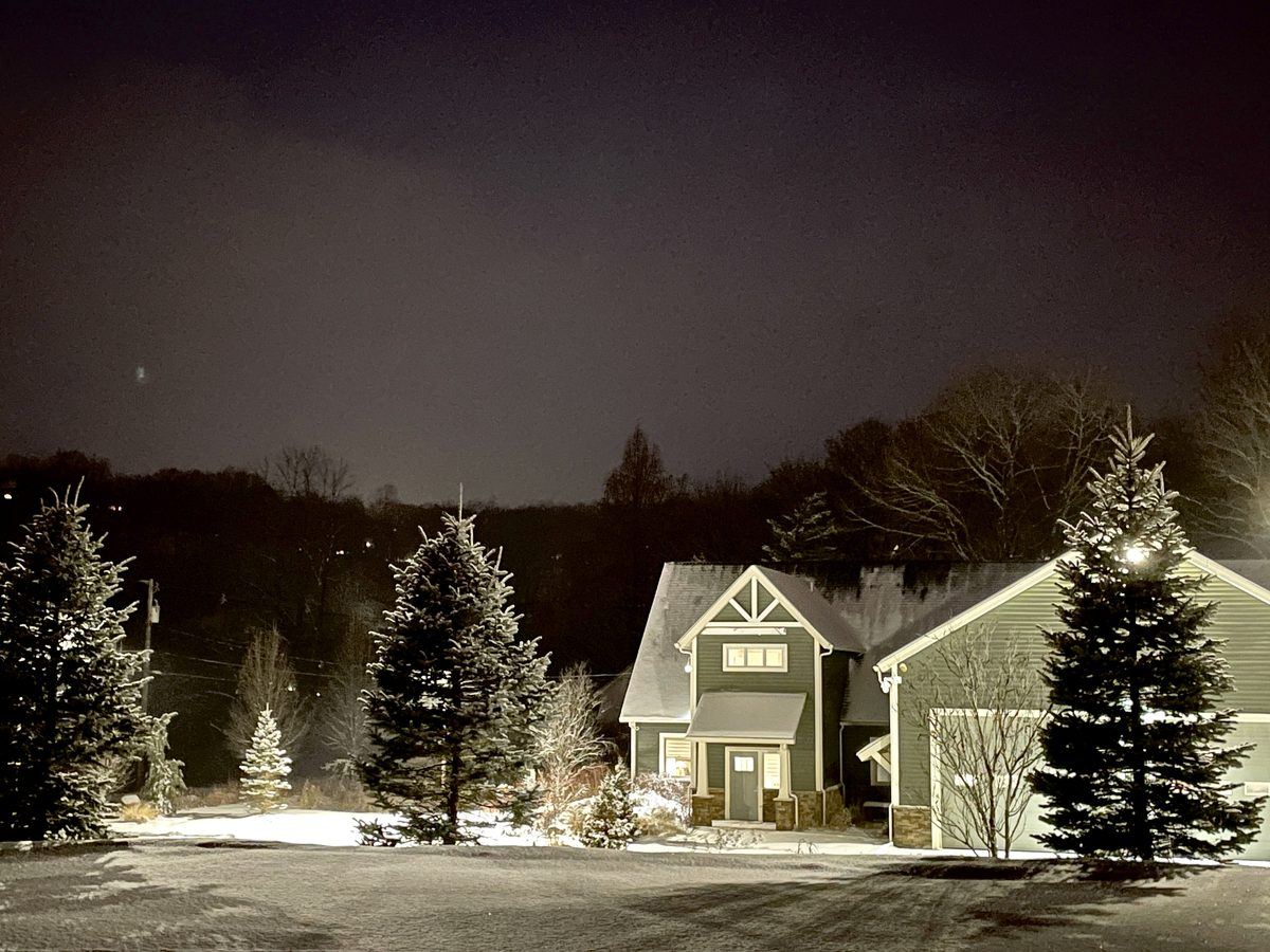 The brewery on a winter night, snow on the trees
